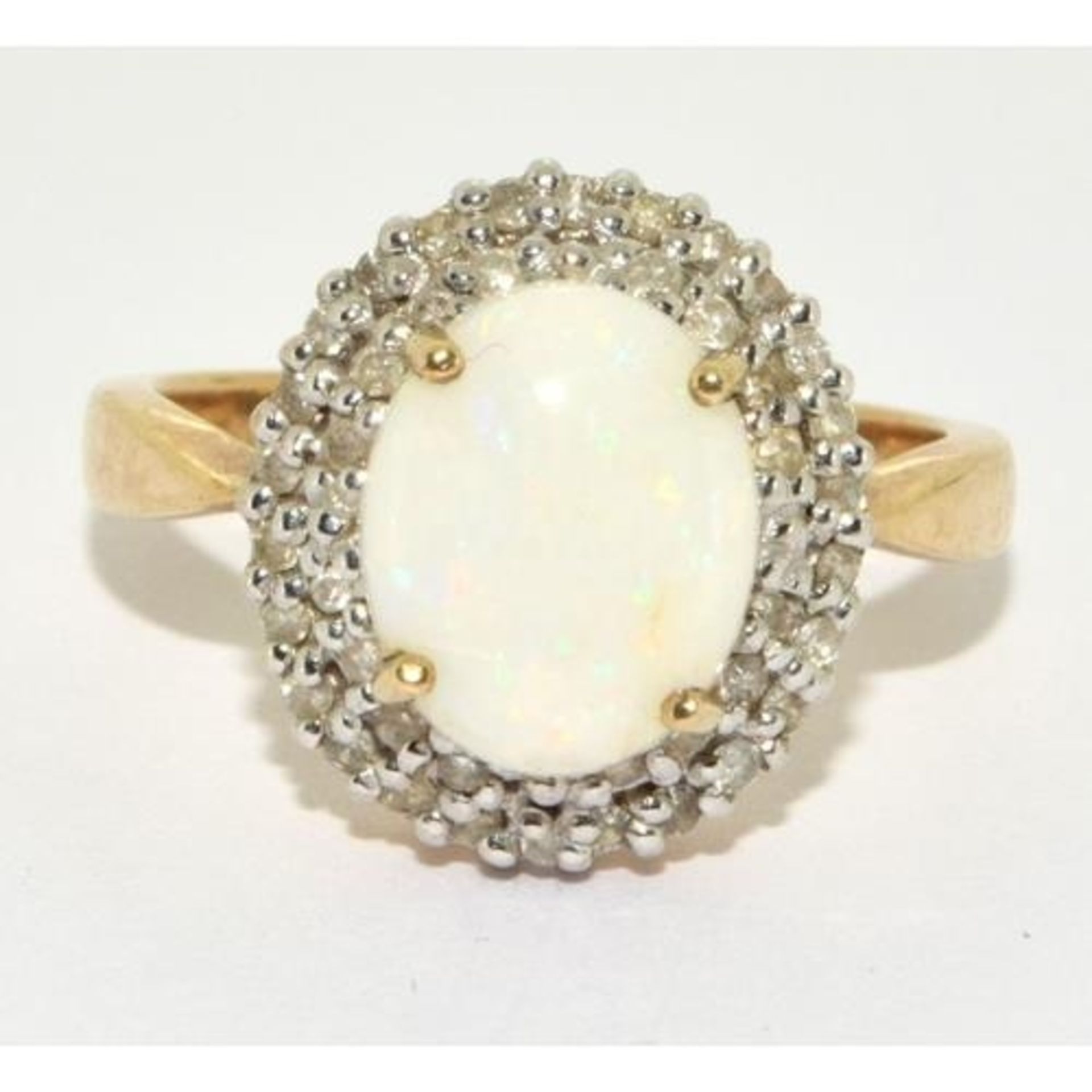 9ct gold ladies Diamond and Opal statement ring in a halo design setting approx size N