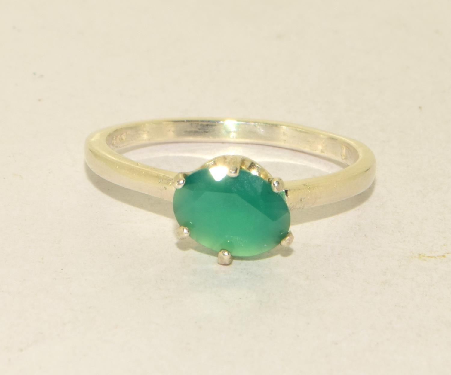 A 925 silver solitaire green stone ring Size P 1/2.