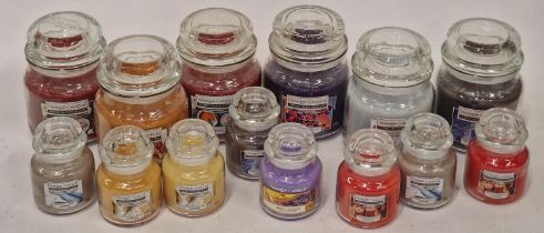 Six assorted Medium yankee candles together with 8 small Yankee candles. (219)