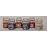 Six assorted Yankee candles (221)
