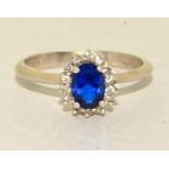 A 925 silver and sapphire cluster ring Size R 1/2.