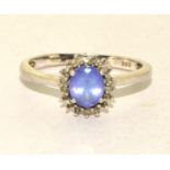 A 925 silver and lavender stone ring Size O