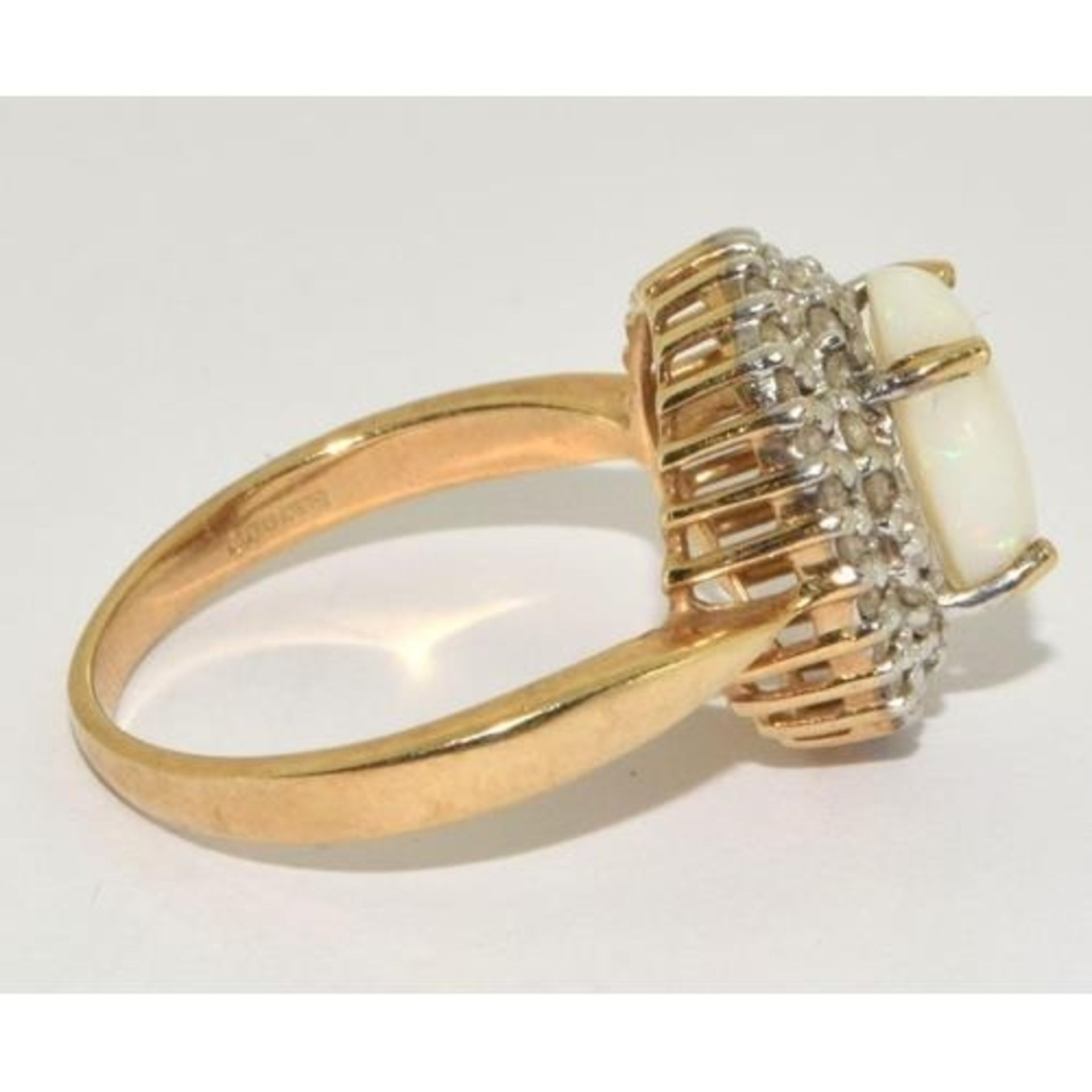 9ct gold ladies Diamond and Opal statement ring in a halo design setting approx size N - Image 4 of 5
