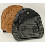 A black MCM rucksack 1040k together with a brown similar rucksack. (89,90)