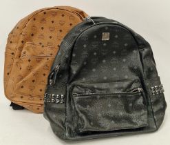 A black MCM rucksack 1040k together with a brown similar rucksack. (89,90)