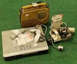 A vintage Bush electric radio together with a DVD player and some electrical travel accessories.