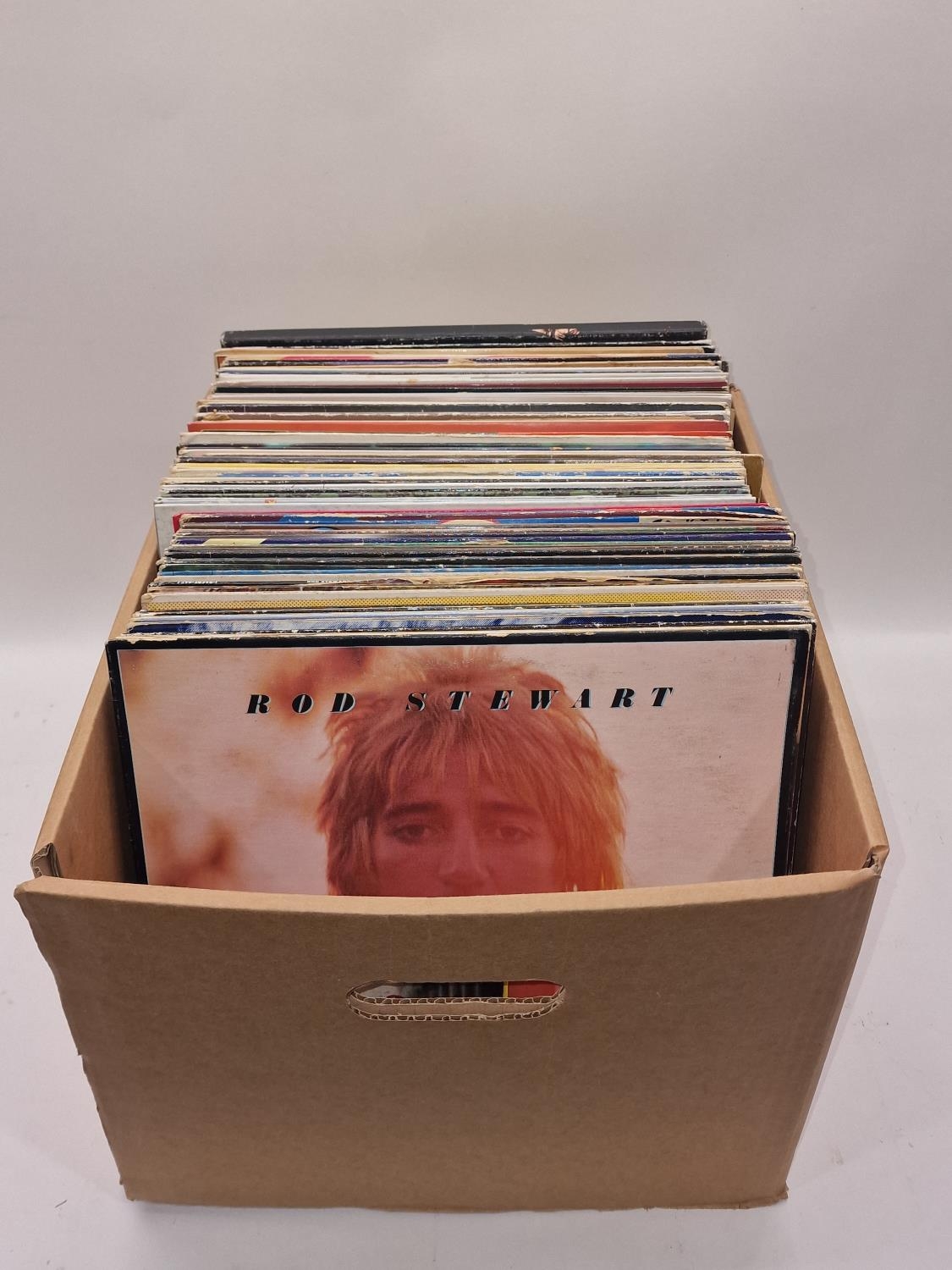 A box containing a large collection of various rock and pop LP records to include Rod Stewart, Cliff
