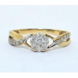 9ct gold Diamond cluster ring with Diamonds to the shank hall marked as 0.25ct size N