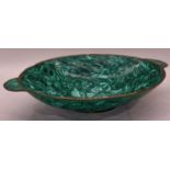 A large Malachite twin handled bowl 42cm wide.