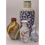 Four pieces of ceramics to include Chinese vase, two art pottery vases and a china duck (4).
