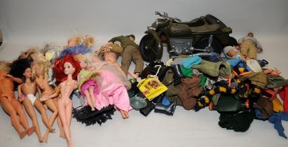 A collection of vintage dolls including Action Man figures, vehicles and clothing