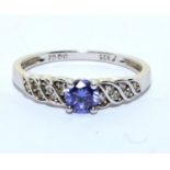 A 925 silver, CZ and tanzanite ring Size R