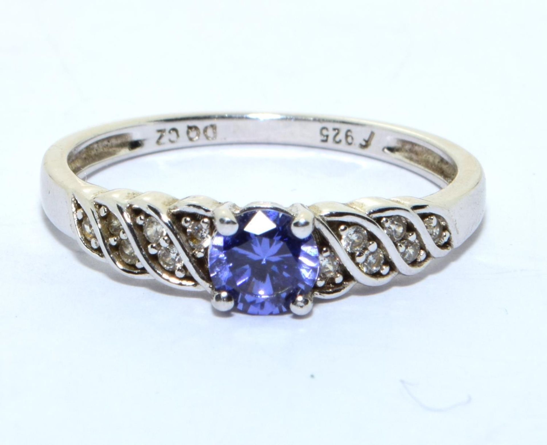 A 925 silver, CZ and tanzanite ring Size R