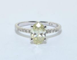 Diamond solitaire approx 1.5ct oval shape yellow diamond with diamond shoulders in a 14ct white gold