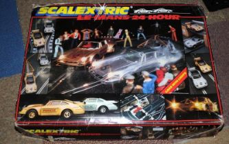 Vintage Scalextric Le Mans 24 Hour slot car racing set with spare track and lap counter. Appears