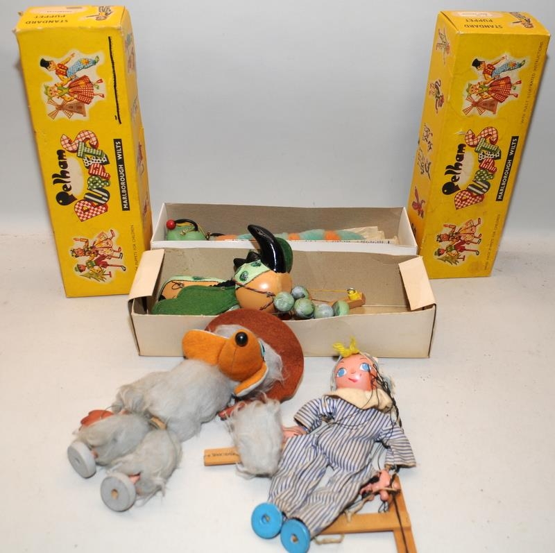 Four vintage Pelham Puppets to include boxed Baby Dragon and Caterpillar, and unboxed Orinoco Womble