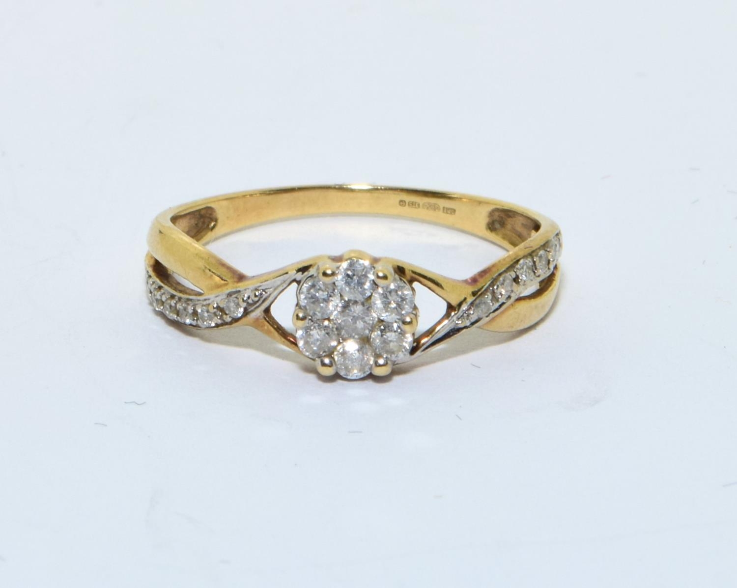 9ct gold Diamond cluster ring with Diamonds to the shank hall marked as 0.25ct size N - Image 5 of 5