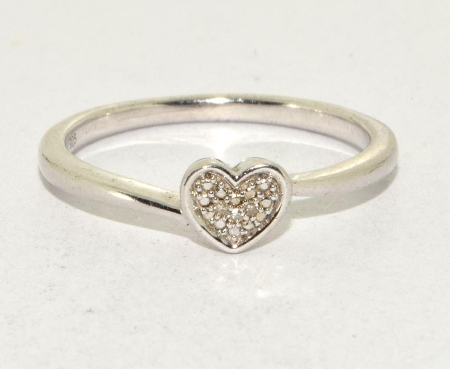 A 925 silver heart ring Size O