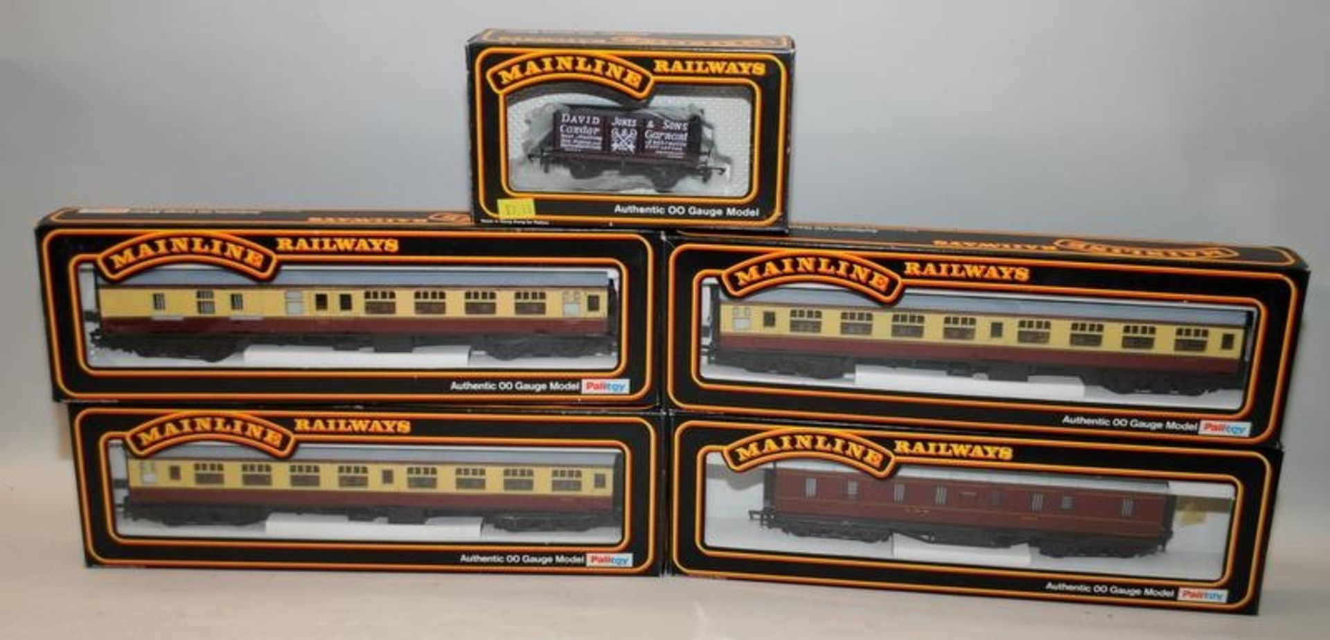 Mainline Railways OO gauge coaches, BR cream/crimson x 3 and LMS maroon x 1 c/w an open wagon. 5