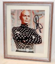 Yul Brynner The King and I signed photograph. Frame size 29cms x 34cms. Unauthenticated but signed