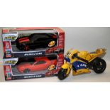 2 x boxed remote control Muscle Cars c/w a tinplate Team Yamaha motorcycle