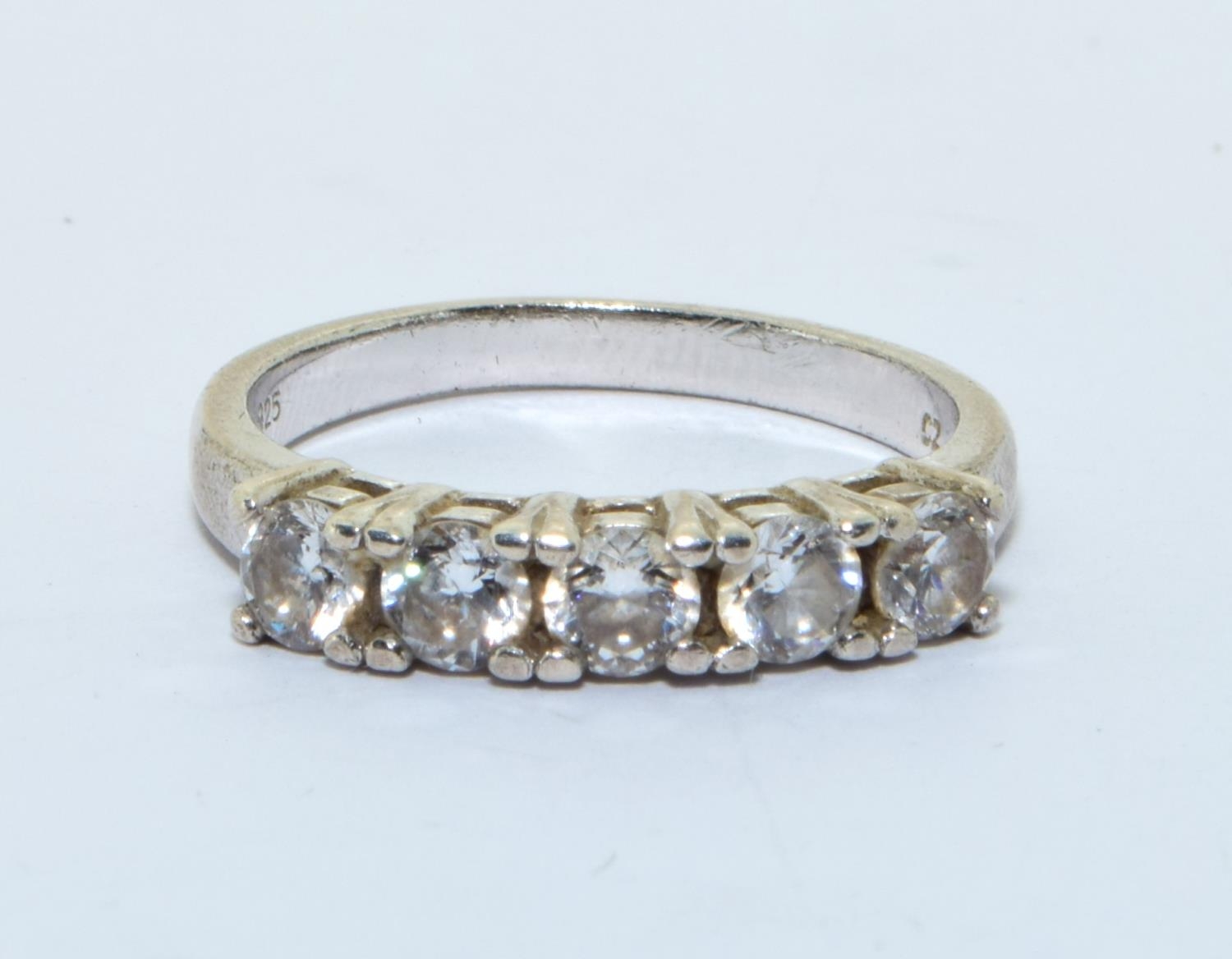 A 925 silver and CZ five stone ring Size M