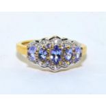 A stunning gold on 925 silver and tanzanite ring, Size P