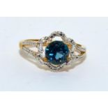 9ct gold Blue Topaz and Diamond halo design ring size N