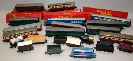 A collection of OO gauge goods wagons and coaches, some boxed