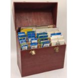 Wooden case containing a large quantity of new old stock stamp mounts ideal for a stamp collector.