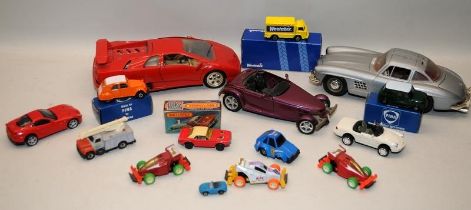 A small collection of loose and boxed die-cast vehicles. Matchbox, Maisto, Bburago etc