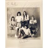 0RIGINAL STATUS QUO AUTOGRAPHS. Found here are 4 band members on a 8” x 10” black and white promo