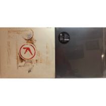 2 VINYL LP RECORDS FROM THE APHEX TWINS.