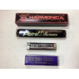 2 BOXED HARMONICAS. Here we have a Parrot 24 holed harmonica in key of C and Echo Super Vamper by