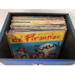 SMALL CARRY CASE OF ROCK / POP RELATED VINYL SINGLES. Artists include Queen - Revilos- Pirahnas -