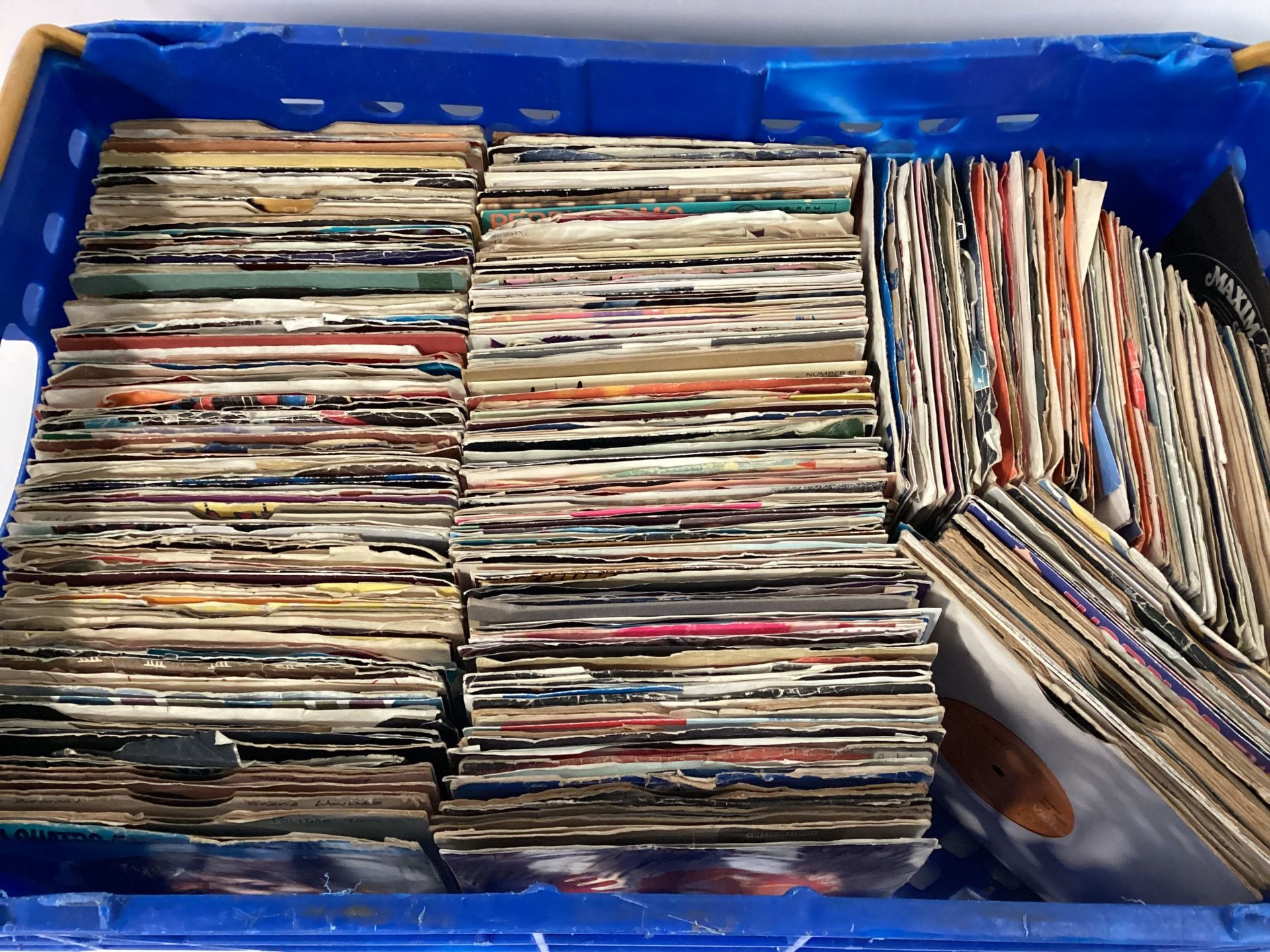 CRATE OF VARIOUS 45RPM 7” SINGLES. Many artists mixed here from across the decades found in