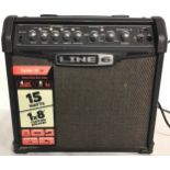 GUITAR AMPLIFIER BY LINE 6. This unit is model number Spider IV 15 and powers up when plugged in.