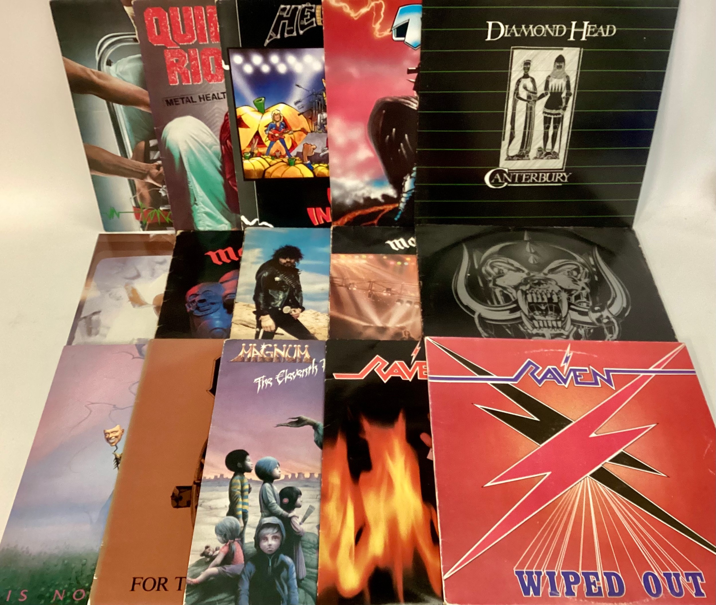SELECTION OF 15 HEAVY METAL VINYL LP RECORDS. Artists here include - AC/DC - Motörhead - Magnum -