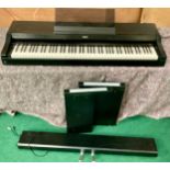 KORG ELECTRONIC PIANO. This powers up fine and comes with its legs / Stand and foot pedals and is