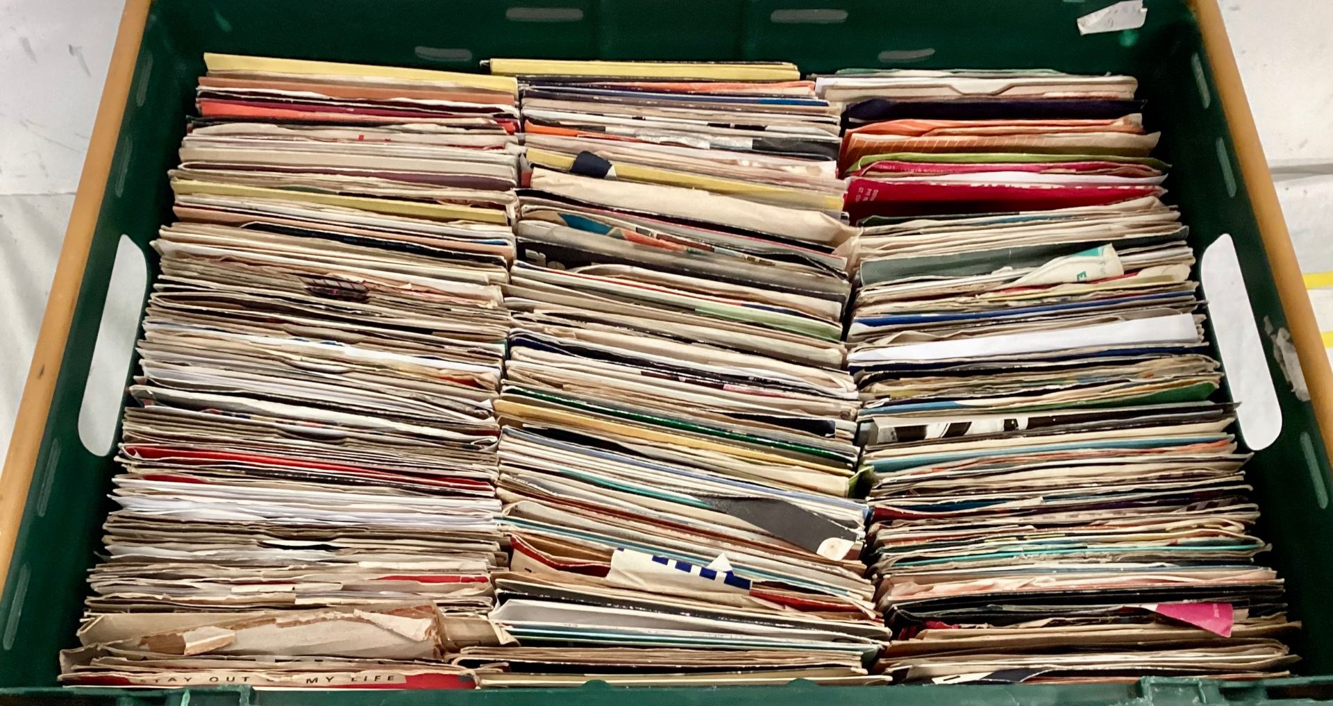 LARGE TRAY OF VARIOUS 7” SINGLES. There is many genres and artists found amounts this mixture and