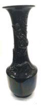 A large black glazed oriental dragon vase.