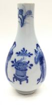 Chinese blue and white bottle vase depicting young ladies 18cm tall