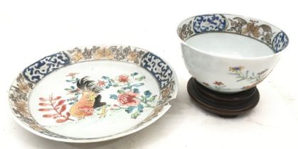 A Chinese Famille rose cup and saucer.