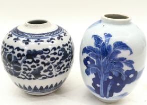 A small Chinese blue and white jar together with another. Tallest jar 10cm