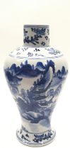 A blue and white Chinese vase. 23cm tall