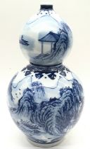 Oriental Chinese blue and white Gourde vase with landscape decoration marks to the base 36x18cm