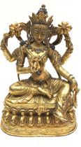 Bronzed gilt model of a deity inscribed to the base 16cm tall