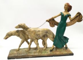 Large Art Deco Chalkware figure of a lady in a green dress walking borzoi dogs. Base is 54cms x