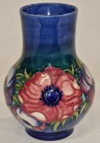Moorcroft cobalt blue floral vase signed and stamped to base 18cm tall.