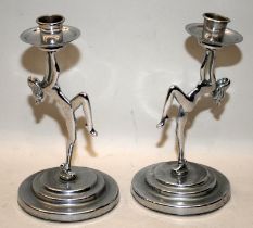 Pair of chrome candlesticks featuring nude female figures in the Art Deco style. 19.5cms tall